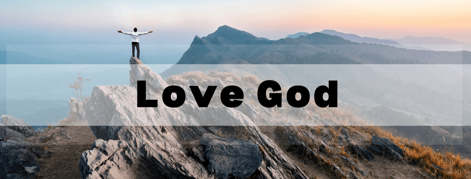 Love God header man standing on mountain with arms out